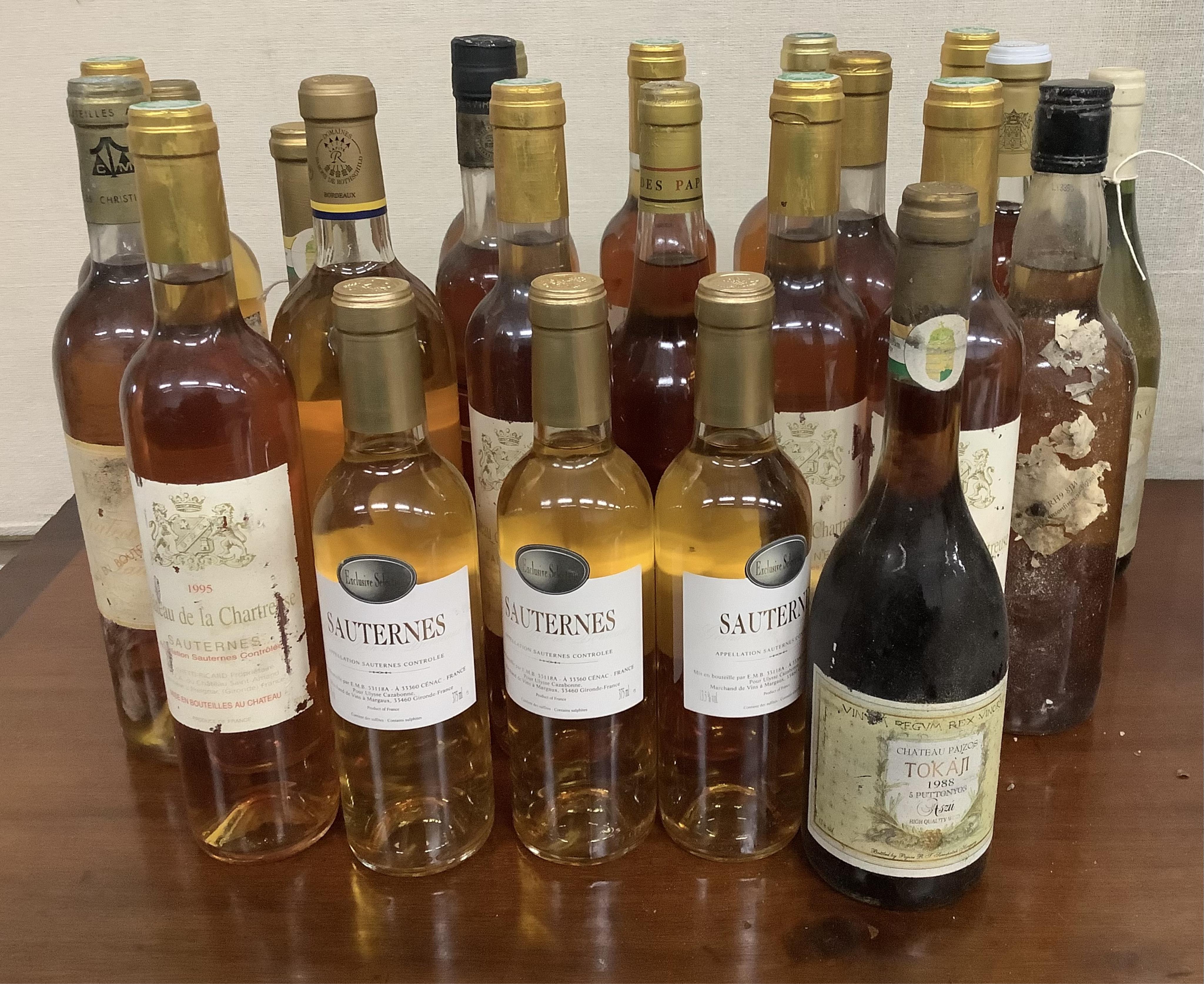 Twenty three bottles of assorted Sauternes, Muscat and Tokaji, various ages. Condition - fair to good, from a local private cellar